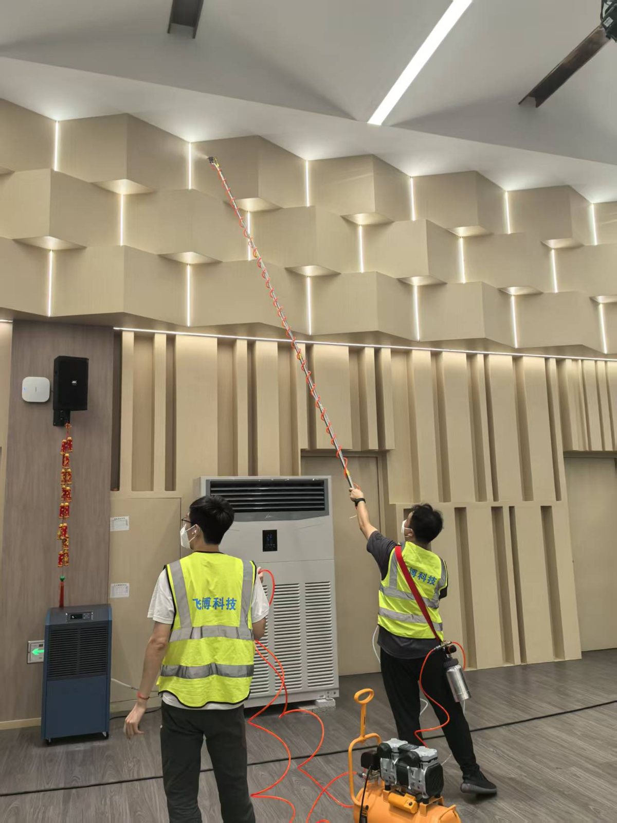 Long-pole spraying of acoustic walls